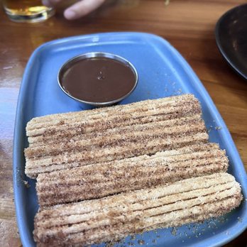 T'zunun - Churro with chocolate mezcal dipping sauce - Cocktail Bars Near Me - Pleasant Hill, California T'zunun - Churro with chocolate mezcal dipping sauce - Cocktail Bars Near Me - Pleasant Hill, California