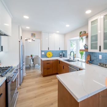 EN Design and Build - a kitchen with white cabinets and wood floors - Interior Design Near Me - San Diego, California EN Design and Build - a kitchen with white cabinets and wood floors - Interior Design Near Me - San Diego, California