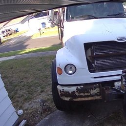 Crane truck very close to front door and partially drove over sewer line. Crane truck very close to front door and partially drove over sewer line.