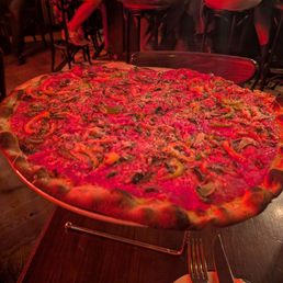 Red pie with mushroom and peppers