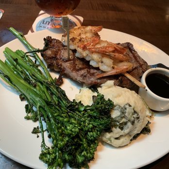 Yard House - Rib Eye & Shrimp, Brocolini and Spinach Mash Potatoes. - New American Near Me - San Antonio, Texas
