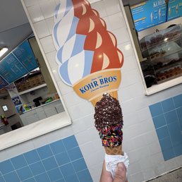 Peanut butter and banana ice cream in a waffle cone with chocolate sprinkles Peanut butter and banana ice cream in a waffle cone with chocolate sprinkles