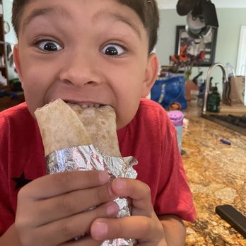 Tacos Gavilan - My little guy biting into his bean and cheese burrito - Tacos Near Me - Azusa, California Tacos Gavilan - My little guy biting into his bean and cheese burrito - Tacos Near Me - Azusa, California