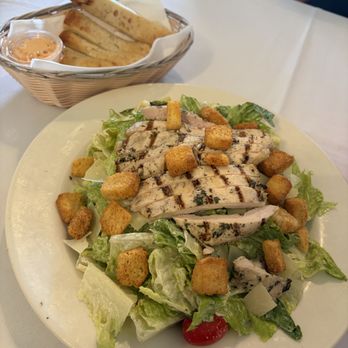 The Pasta Market - Chicken Caesar Salad with bread sticks - Italian Near Me - Los Altos, California The Pasta Market - Chicken Caesar Salad with bread sticks - Italian Near Me - Los Altos, California