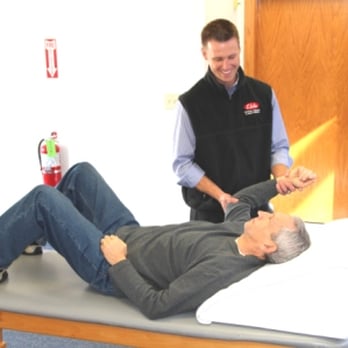 Elite Physical Therapy & Aqua Therapy - ERIK STRETCHING A PATIENT'S SHOULDER. - Physical Therapy Near Me - Danvers, Massachusetts Elite Physical Therapy & Aqua Therapy - ERIK STRETCHING A PATIENT'S SHOULDER. - Physical Therapy Near Me - Danvers, Massachusetts