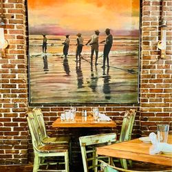 Coast Bar & Grill - Themed Artwork on walls. Notice the gas-fired lanterns!