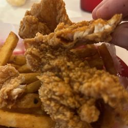 Juicy Seafood - This is a piece of catfish. Do you see the catfish? Thats how thin it is. It was like fried paper.