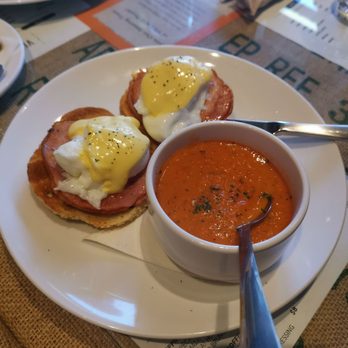 The Village - Traditional eggs Benedict on bagels with a side of tomato parmesan soup - Breakfast & Brunch Near Me - Victoria, British Columbia The Village - Traditional eggs Benedict on bagels with a side of tomato parmesan soup - Breakfast & Brunch Near Me - Victoria, British Columbia
