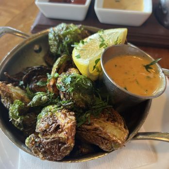 Toulouse Petit Kitchen & Lounge - Side Brussels Sprouts with Tasso TG - Seafood Near Me - Seattle, Washington Toulouse Petit Kitchen & Lounge - Side Brussels Sprouts with Tasso TG - Seafood Near Me - Seattle, Washington