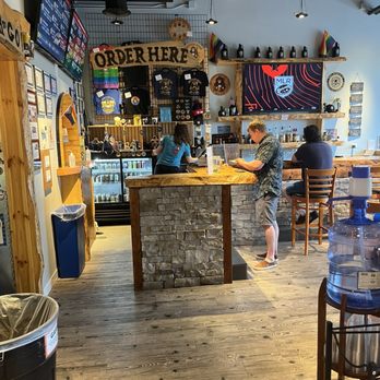 Brother Chimp Brewing - Lots of merch available at the bar which has very pretty natural elements - Breweries Near Me - North Aurora, Illinois