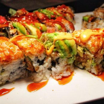Yujo - a plate of sushi with sauce on it - Sushi Bars Near Me - Dracut, Massachusetts