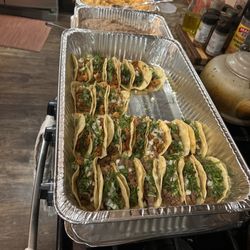 Sarahi's Kitchen - Assortment of tacos, rice, beans and chips/salsa. Not pictured is the container of limes provided, sauces and more tacos