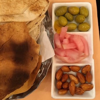 Assanabel - Delicious complimentary appetizer of green olives pickled turnips and soaked all of this with flatbread - Lebanese Near Me - Paris, 75