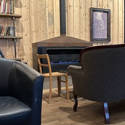 a fireplace in the corner of a living room