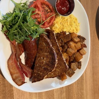 Moxies - Breakfast platter with eggs, bacon, sausage, potatoes, tomato and toast - Lounges Near Me - West Palm Beach, Florida Moxies - Breakfast platter with eggs, bacon, sausage, potatoes, tomato and toast - Lounges Near Me - West Palm Beach, Florida