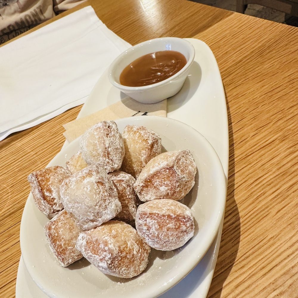 Cortina - Zeppole with caramel sauce - Italian Near Me - Seattle, Washington Cortina - Zeppole with caramel sauce - Italian Near Me - Seattle, Washington