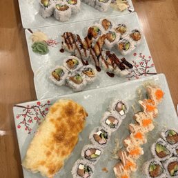 a variety of sushi on plates a variety of sushi on plates