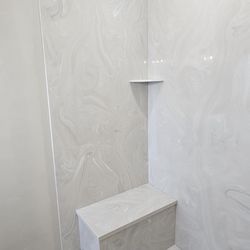 Pro Marble - Dove and sterling silver shower with a bench seat and custom pan