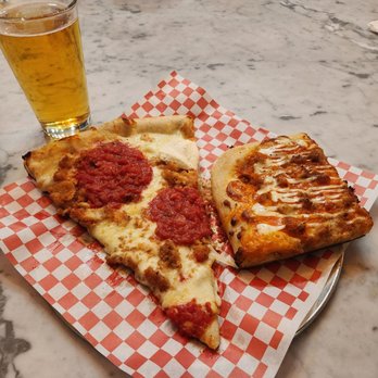 Due Amici Pizza & Pasta Bar - On the left is a chicken parmesan slice and on the right is a Sicilian style buffalo chicken, all with a Peroni pale lager on tap - Pizza Near Me - Tampa, Florida Due Amici Pizza & Pasta Bar - On the left is a chicken parmesan slice and on the right is a Sicilian style buffalo chicken, all with a Peroni pale lager on tap - Pizza Near Me - Tampa, Florida