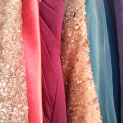 Candy's Collections & Alterations - Prom dresses hanging in candy's sewing room that she altered or made from scratch!