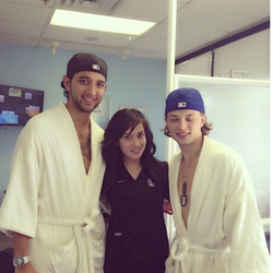 Hangover Heaven - Crystal poses with patients in the clinic.
