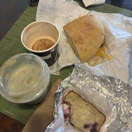 Iced matcha with oat milk, hot latte oat milk with cinnamon, gluten free lemon poppyseed loaf, sausage egg & cheese on local bread Iced matcha with oat milk, hot latte oat milk with cinnamon, gluten free lemon poppyseed loaf, sausage egg & cheese on local bread