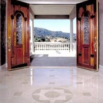 Tile Plus - An entry-way  installed with different colors of marble to create compass focal point. - Flooring Near Me