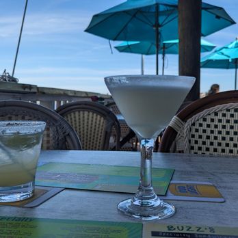 Buzz's Lighthouse Inn and Restaurant - two cocktails on a table - Seafood Near Me - Naples, Florida Buzz's Lighthouse Inn and Restaurant - two cocktails on a table - Seafood Near Me - Naples, Florida