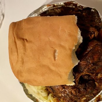 Just Jerk - My partially eaten coco bread - Caribbean Near Me - Lanham, Maryland Just Jerk - My partially eaten coco bread - Caribbean Near Me - Lanham, Maryland