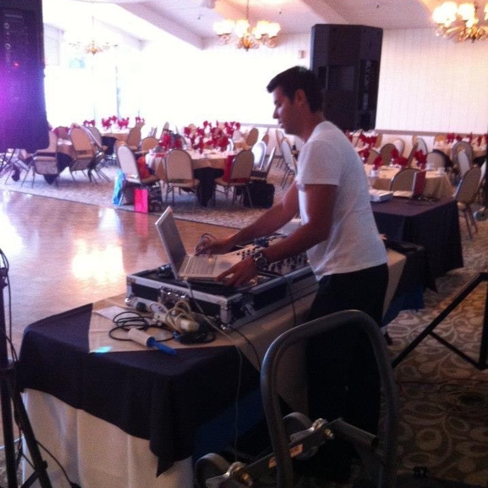 DJ Sal Meda - DJ Sal settings up for an event - DJs Near Me DJ Sal Meda - DJ Sal settings up for an event - DJs Near Me