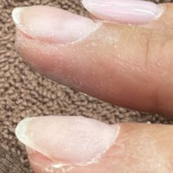 The Nail Shoppe of S Tampa - Look how smooth the nail behind is and how thick and chunky and not smooth the two underneath are.