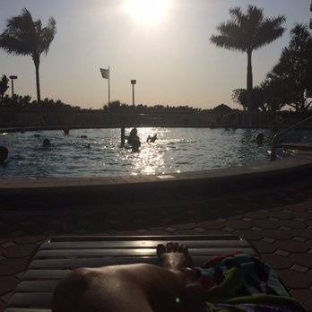 Marco Island - Lounging by the heated pool - Real Estate Near Me