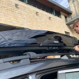 The rei crew hard at work installing my Thule Cargo Box. The rei crew hard at work installing my Thule Cargo Box.
