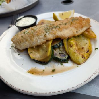 Lure Lakebar - Walleye with grilled zucchini and squash, and a tasty tartar sauce. In the background is a burger with really good fries. - New American Near Me - Alexandria, Minnesota Lure Lakebar - Walleye with grilled zucchini and squash, and a tasty tartar sauce. In the background is a burger with really good fries. - New American Near Me - Alexandria, Minnesota