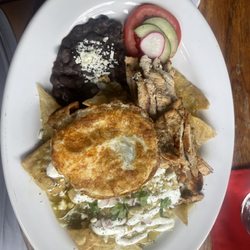 A Page in the Sun - Chilaquiles verde with grilled chicken and fricken egg. Delicious!