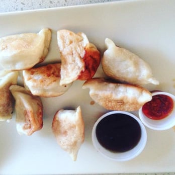 Five Spice Kitchen - a plate of dumplings with dipping sauce - Vietnamese Near Me - Calgary, Alberta Five Spice Kitchen - a plate of dumplings with dipping sauce - Vietnamese Near Me - Calgary, Alberta