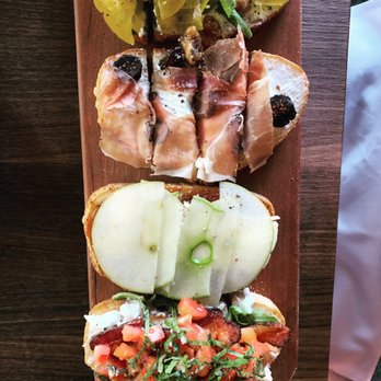 Postino Broadway - Bruschetta - Seasonal, prosciutto fig & mascarpone , apple fig & brie, burrata bacon arugula & tomato. - Wine Bars Near Me - Denver, Colorado Postino Broadway - Bruschetta - Seasonal, prosciutto fig & mascarpone , apple fig & brie, burrata bacon arugula & tomato. - Wine Bars Near Me - Denver, Colorado
