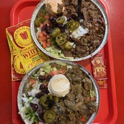 The Halal Guys - Beef gyro and braised lamb over salad. Yum!