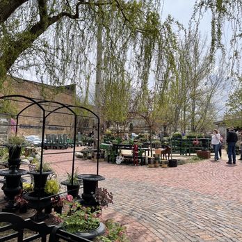 Blumen Gardens - a brick patio surrounded by trees - Nurseries & Gardening Near Me - Sycamore, Illinois