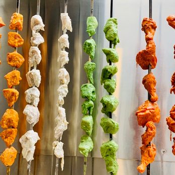 Samrat Indian Cuisine - a row of skewered food - Indian Near Me - Toronto, Ontario Samrat Indian Cuisine - a row of skewered food - Indian Near Me - Toronto, Ontario