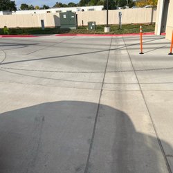 Showing what I saw when pulling into car wash area. Log chain invisible to drivers entering to wash entrance.. $1500 damages to paint