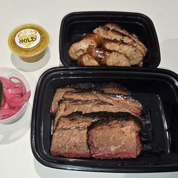 Soul & Smoke West Loop - Soul and Smoke brisket and jalapeño cheddar sausage, with a side of pickled onions and pickles. The sauce is a Georgia mustard sauce. - Soul Food Near Me - Chicago, Illinois Soul & Smoke West Loop - Soul and Smoke brisket and jalapeño cheddar sausage, with a side of pickled onions and pickles. The sauce is a Georgia mustard sauce. - Soul Food Near Me - Chicago, Illinois