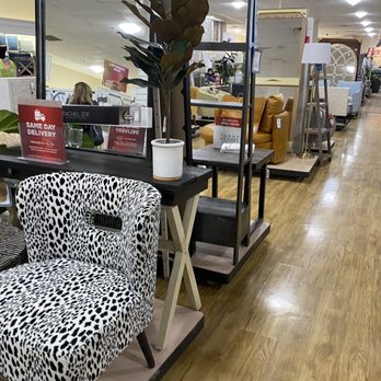 Homegoods Store - Interior of a HomeGoods store showing furniture displays, including a leopard print chair, shelves, and a wooden floor. - Department Stores Near Me - Algonquin, Illinois