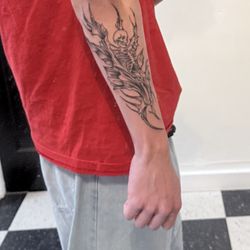Black Needle Tattoo