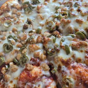 Roman's Pizza - Sausage and green olive baked perfectly! - Pizza Near Me - Denton, Texas Roman's Pizza - Sausage and green olive baked perfectly! - Pizza Near Me - Denton, Texas