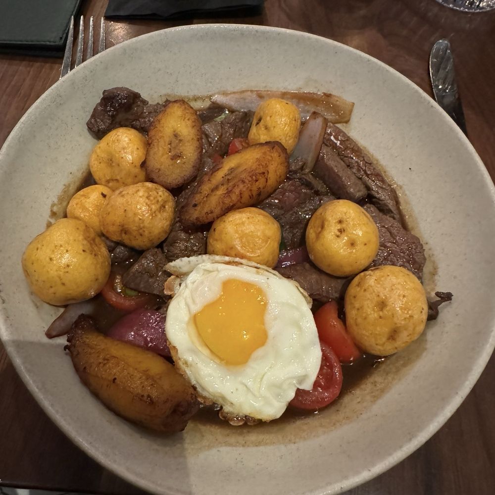 Pisco Peruvian Gastrobar - Wagyu Saltado. Very good, especially with addition of the egg and maduros (sweet plantains) - Peruvian Near Me - Orlando, Florida Pisco Peruvian Gastrobar - Wagyu Saltado. Very good, especially with addition of the egg and maduros (sweet plantains) - Peruvian Near Me - Orlando, Florida