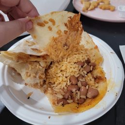 Ordered the kids quesadilla with rice and beans, apparently it's a quesadilla with rice and beans inside of it? Ordered the kids quesadilla with rice and beans, apparently it's a quesadilla with rice and beans inside of it?
