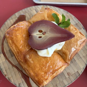 Izola - Wine soaked Pear Croissant - Bakeries Near Me - San Diego, California Izola - Wine soaked Pear Croissant - Bakeries Near Me - San Diego, California