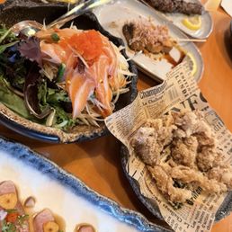 Salmon papaya, kind oyster mushroom, chicken skin, yellowtail carpaccio isaan style and beef skewers Salmon papaya, kind oyster mushroom, chicken skin, yellowtail carpaccio isaan style and beef skewers