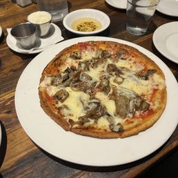 The pizza is a thin crust! We went with the eggplant, onion, and mozzarella! Very tasty! The pizza is a thin crust! We went with the eggplant, onion, and mozzarella! Very tasty!